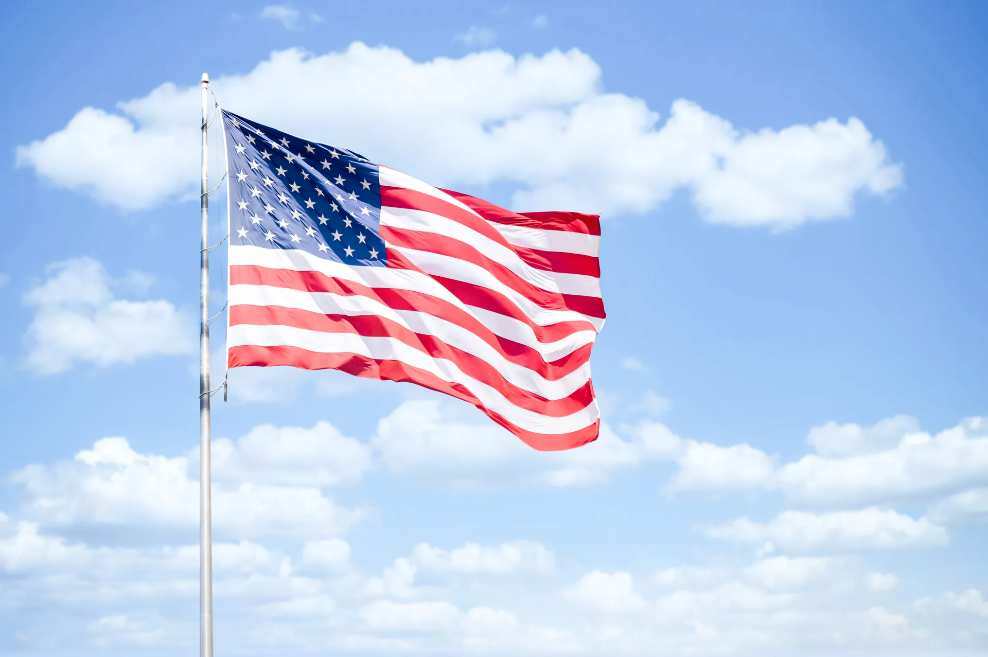 American flag against blue sky